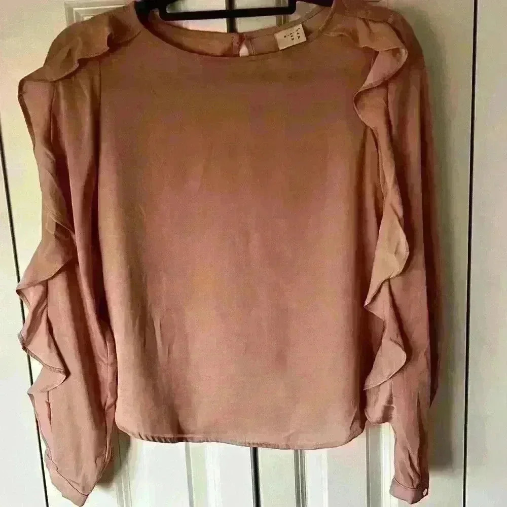 A NEW DAY - silky pinkish/peachy color shirt with arm ruffle detail. Si…